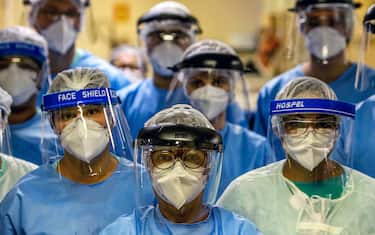 A group of doctors working with patients infected with the novel coronavirus COVID-19 wear face shields at the Intensive Care Unit of the Hospital de Clinicas in Porto Alegre, Brazil, on April 15, 2020. - With Brazilians increasingly ignoring health officials' warnings to stay home -- encouraged by their far-right president Jair Bolsonaro, who has condemned the "hysteria" over the virus -- predictions for how the pandemic will play out in the hardest-hit country in Latin America are getting dire. (Photo by Silvio AVILA / AFP) (Photo by SILVIO AVILA/AFP via Getty Images)
