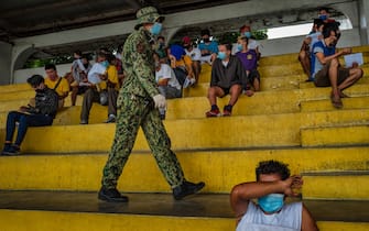 MANILA, PHILIPPINES - JULY 08: People arrested for not wearing face masks are detained at a stadium on July 8, 2020 in Quezon city, Metro Manila, Philippines. President Rodrigo Duterte expressed concern with reopening the country as it struggles to contain the spread of the coronavirus. With more than 45,000 cases and more than a thousand deaths, the Philippines is the second worst coronavirus-hit country in Southeast Asia, despite imposing the longest lockdown in the world surpassing a hundred days that has left millions of Filipinos jobless and hungry. (Photo by Ezra Acayan/Getty Images)