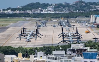 GINOWAN, JAPAN - MAY 31: MV-22 Osprey aircraft sit on a runway at Marine Corps Air Station Futenma on May 31, 2018 in Ginowan, Okinawa prefecture, Japan. Demonstrators protesting against the U.S military presence on the southern Japanese island of Okinawa have staged continuous protests outside Camp Schwab to block construction vehicles as the camp is expanded to accommodate the relocation of an airbase in nearby Henoko. (Photo by Carl Court/Getty Images)