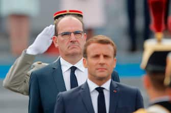 French President Emmanuel Macron (front) and French Prime Minister Jean Castex review troops prior to the annual Bastille Day military ceremony on the Place de la Concorde in Paris, on July 14, 2020. - France holds a reduced version of its traditional Bastille Day parade this year due to safety measures over the COVID-19 (novel coronavirus) pandemic, and with the country's national day celebrations including a homage to health workers and others fighting the outbreak. (Photo by Christophe Ena / various sources / AFP) (Photo by CHRISTOPHE ENA/AP/AFP via Getty Images)