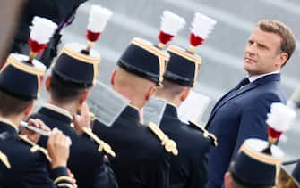 French President Emmanuel Macron reviews the guard of honour during the annual Bastille Day military ceremony on the Place de la Concorde in Paris, on July 14, 2020. - France holds a reduced version of its traditional Bastille Day parade this year due to safety measures over the COVID-19 (novel coronavirus) pandemic, and with the country's national day celebrations including a homage to health workers and others fighting the outbreak. (Photo by Thomas SAMSON / AFP) (Photo by THOMAS SAMSON/AFP via Getty Images)