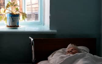 79793253 KOSTYRINO, RUSSIA - JANUARY 28: (RUSSIA OUT) A patient rests in bed in mental hospital number 2, January 28, 2008 in Kostyrino, Russia. The head doctor of the hospital uses art therapy as method of diagnostics, which helps to understand patients state of health. (Photo by Oleg Klimov/Epsilon/Getty Images)