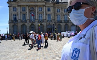 Health care workers demonstrate in Bordeaux on July 14, 2020, against the wage agreements as part of the 'Segur de la Sante' (general talks on Health reforms) aimed at improving working conditions, salaries and patient care in the medical sector. - Health care workers are protesting in France on the country's National day to demand more for their sector a day after the government and unions signed an agreement giving over eight billion euros in pay rises, with the prime minister admitting the move was overdue in view of the coronavirus pandemic. (Photo by MEHDI FEDOUACH / AFP) (Photo by MEHDI FEDOUACH/AFP via Getty Images)