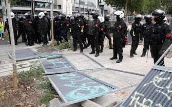 Members of the French "Brigade de repression de l'action violente (BRAV-M)" (Brigade of repression of violent action) stand during a demonstration in Paris, on July 14, 2020, as part of a nationwide day of protests by health workers to demand better work conditions. - Health care workers are protesting in France on the country's National day to demand more for their sector a day after the government and unions signed an agreement giving over eight billion euros in pay rises, with the prime minister admitting the move was overdue in view of the coronavirus pandemic. (Photo by Zakaria ABDELKAFI / AFP) (Photo by ZAKARIA ABDELKAFI/AFP via Getty Images)