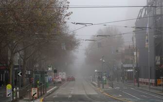 MELBOURNE, AUSTRALIA - JULY 17: Fog is seen over the the top end of Bourke St on July 17, 2020 in Melbourne, Australia. Metropolitan Melbourne and the Mitchell shire are currently in lockdown following the rise in COVID-19 cases through community transmissions. The new restrictions came into effect on Thursday 9 July, with residents in lockdown areas under stay at home orders until 19 August. People are only able to leave home have for exercise or work, to buy essential items including food or to access childcare and healthcare. (Photo by Robert Cianflone/Getty Images)