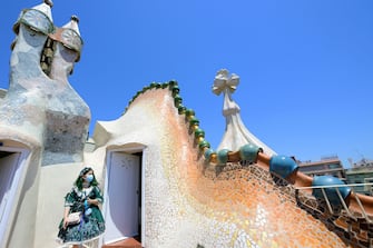 A woman visits Spanish architect Antonio Gaudi's Casa Batllo on July 1, 2020 in Barcelona, on the first day it reopens to the public after more than three months of closure amid the new coronavirus pandemic. (Photo by LLUIS GENE / AFP) (Photo by LLUIS GENE/AFP via Getty Images)