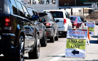 Vehicles make their way to a COVID-19 test site in Los Angeles, California on July 21, 2020. - California on July 21 reported a total of 400,769 COVID-19 cases since the pandemic began, approaching the numbers of New York, the state with the most cases. (Photo by Frederic J. BROWN / AFP) (Photo by FREDERIC J. BROWN/AFP via Getty Images)