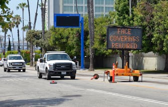 LOS ANGELES, CALIFORNIA - JULY 21: A coronavirus warning sign is displayed on July 21, 2020 in Santa Monica, California. Los Angeles Mayor Garcetti may soon curtail access to beaches and other activities in Los Angeles if COVID-19 continues to spread in the city, which could cause another lockdown. (Photo by Michael Tullberg/Getty Images)