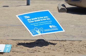 LOS ANGELES, CALIFORNIA - JULY 21: A Coronavirus sign is posted at Santa Monica State Beach on July 21, 2020 in Santa Monica, California. Los Angeles Mayor Garcetti may soon curtail access to beaches and other activities in Los Angeles if COVID-19 continues to spread in the city, which could cause another lockdown. (Photo by Michael Tullberg/Getty Images)
