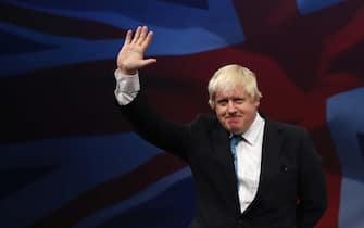 491519992 MANCHESTER, ENGLAND - OCTOBER 06: London mayor Boris Johnson waves after speaking to conference on the third day of the Conservative party conference on October 6, 2015 in Manchester, England. The third day of the 2015 autumn conference is being dominated by tough new measures to deal with mass immigration in the Conservative conference speech. (Photo by Dan Kitwood/Getty Images)