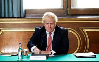 LONDON, ENGLAND - JULY 21: Prime Minister Boris Johnson chairs a face-to-face meeting of his cabinet team of ministers, the first since mid-March, on July 21, 2020 in London, England. The meeting in the FCO will take place in a ventilated room in the Foreign Office large enough to allow ministers to sit at least one metre apart. (Photo by Simon Dawson - WPA Pool/Getty Images)