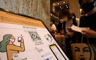 SEOUL, SOUTH KOREA - JULY 21: Instructions and QR code for SafeEntry contact tracing is displayed amid coronavirus at a Sejong Culture Center for ahead of musical 'Mozart' on July 21, 2020 in Seoul, South Korea. With the number of daily local cases recently hovering around 20 or below, but imported cases continued to rise by double digit figures. South Korea resumed operations of some museums and libraries in the greater Seoul area starting yeaterday. Health authorities, however, are still vigilant over the spread of the virus in vacation spots over the summer, pointing out that the season will serve as a critical juncture for the nation's anti-virus fight. The country added 45 cases toddy, including 20 local infections, raising the total caseload to 13,816, according to the Korea Centers for Disease Control and Prevention (KCDC). (Photo by Chung Sung-Jun/Getty Images)
