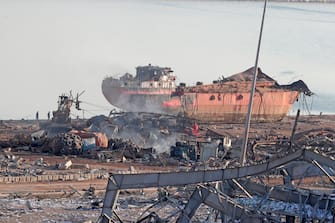 The wreckage of a ship is seen following yesterday's blast at the port of Lebanon's capital Beirut, on August 5, 2020. - Rescuers worked through the night after two enormous explosions ripped through Beirut's port, killing at least 78 people and injuring thousands, as they wrecked buildings across the Lebanese capital. (Photo by ANWAR AMRO / AFP) (Photo by ANWAR AMRO/AFP via Getty Images)