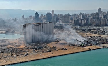 An aerial view shows the massive damage done to Beirut port's grain silos (C) and the area around it on August 5, 2020, one day after a mega-blast tore through the harbour in the heart of the Lebanese capital with the force of an earthquake, killing more than 100 people and injuring over 4,000. - Rescuers searched for survivors in Beirut in the morning after a cataclysmic explosion at the port sowed devastation across entire neighbourhoods, killing more than 100 people, wounding thousands and plunging Lebanon deeper into crisis. (Photo by - / AFP) (Photo by -/AFP via Getty Images)