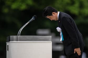 HIROSHIMA, JAPAN - AUGUST 06: Japanese Prime Minister, Shinzo Abe, bows after making a speech during the 75th anniversary of the Hiroshima atomic bombing, on August 6, 2020 in Hiroshima, Japan. In a ceremony that has been scaled back significantly because of Covid-19 coronavirus, Japan will mark the 75th anniversary of the first atomic bomb that was dropped by the United States on Hiroshima on August 6, 1945. The bomb instantly killed an estimated 70,000 people and thousands more in coming years from radiation effects. Three days later the United States dropped a second atomic bomb on Nagasaki which ended World War II. (Photo by Carl Court/Getty Images)
