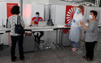 Travel wait inside of the Germany's first walk-in test center for corona viruses (COVID-19) at an airport at Frankfurt International Airport, Germany, 30 June 2020. ANSA/RONALD WITTEK