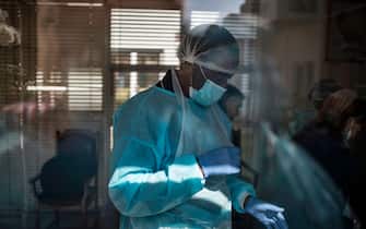 A nurse wearing personal protective equipment (PPE) is seen at Casa Serena, an Old Age home in Johannesburg, on July 22, 2020. - Senior residents of the old age home Casa Serena in Johannesburg are devastated by a rigid COVID-19 coronavirus quarantine, following a deadly spike in cases inside the institution.
At least 17 facilities were affected by COVID-19 coronavirus in the Gauteng province. (Photo by MARCO LONGARI / AFP) (Photo by MARCO LONGARI/AFP via Getty Images)