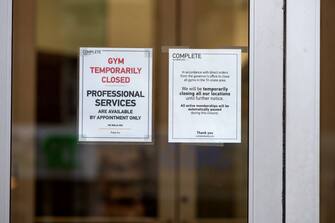 NEW YORK, NEW YORK - JULY 30: A gym temporarily closed sign is seen on a Complete Body Health Club entrance as the city continues Phase 4 of re-opening following restrictions imposed to slow the spread of coronavirus on July 30, 2020 in New York City. The fourth phase allows outdoor arts and entertainment, sporting events without fans and media production. (Photo by Alexi Rosenfeld/Getty Images)