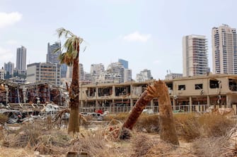 A view shows the damages at the site of the explosion in the port of Beirut, Lebanon, on August 6, 2020 two days after a massive explosion devastated the Lebanese capital in a disaster that has sparked grief and fury. - French President Emmanuel Macron visited shell-shocked Beirut on August 6, pledging support and urging change after a massive explosion devastated the Lebanese capital in a disaster that has sparked grief and fury. (Photo by Thibault Camus / POOL / AFP) (Photo by THIBAULT CAMUS/POOL/AFP via Getty Images)