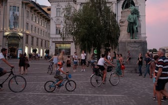LJUBLJANA, SLOVENIA - JULY 31: Cyclists on Preernov Trg in Ljubljana, the capital of Slovenia on July 31, 2020 in Ljubljana, Slovenia. The number of people using bicycles to commute has risen since the COVID-19 epidemic was declared in March 2020. Slovenians on bicycles have been protesting for weeks, as the spread of COVID-19 has coincided with the return to power of the right-wing Prime Minister Janez Jansa. (Photo by Matic Zorman/Getty Images)