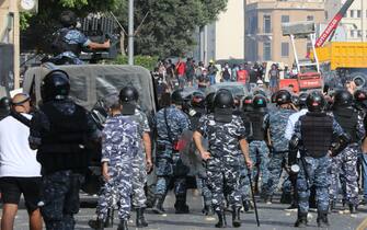 Security forces and demonstrators gather in downtown Beirut on October8, 2020, during a demonstration against a political leadership they blame for a monster explosion that killed more than 150 people and disfigured the capital Beirut. (Photo by Anwar AMRO / AFP) (Photo by ANWAR AMRO/AFP via Getty Images)