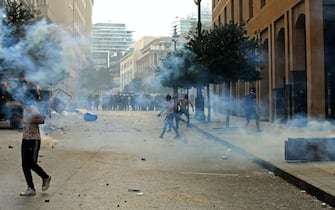 1227962380 Lebanese protesters clash with security forces in downtown Beirut on October8, 2020, following a demonstration against a political leadership they blame for a monster explosion that killed more than 150 people and disfigured the capital Beirut. (Photo by Anwar AMRO / AFP) (Photo by ANWAR AMRO/AFP via Getty Images)