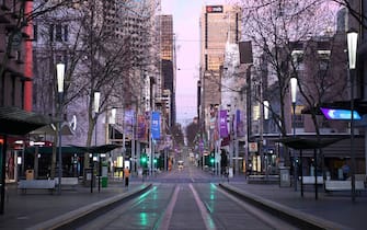 MELBOURNE, AUSTRALIA - AUGUST 11: A very quiet Bourke Street is seen on August 11, 2020 in Melbourne, Australia.  Metropolitan Melbourne  is under stage 4 lockdown restrictions, with people only allowed to leave home to give or receive care, shopping for food and essential items, daily exercise and work while an overnight curfew from 8pm to 5am is also in place. The majority of retail businesses are also closed. Other Victorian regions are in stage 3 lockdown. The restrictions, which came into effect from 2 August, have been introduced by the Victorian government as health authorities work to reduce community COVID-19 transmissions across the state. (Photo by Quinn Rooney/Getty Images)