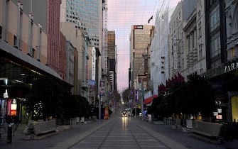 MELBOURNE, AUSTRALIA - AUGUST 11: A very quiet Bourke Street Mall is seen on August 11, 2020 in Melbourne, Australia. Metropolitan Melbourne is under stage 4 lockdown restrictions, with people only allowed to leave home to give or receive care, shopping for food and essential items, daily exercise and work, while an overnight curfew from 8pm to 5am is also in place. The majority of retail businesses are also closed. Other Victorian regions are in stage 3 lockdown. The restrictions, which came into effect from 2 August, have been introduced by the Victorian government as health authorities work to reduce community COVID-19 transmissions across the state. (Photo by Quinn Rooney/Getty Images)