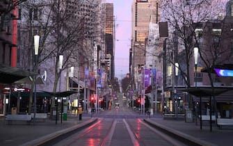MELBOURNE, AUSTRALIA - AUGUST 11: A very quiet Bourke Street is seen on August 11, 2020 in Melbourne, Australia.  Metropolitan Melbourne  is under stage 4 lockdown restrictions, with people only allowed to leave home to give or receive care, shopping for food and essential items, daily exercise and work while an overnight curfew from 8pm to 5am is also in place. The majority of retail businesses are also closed. Other Victorian regions are in stage 3 lockdown. The restrictions, which came into effect from 2 August, have been introduced by the Victorian government as health authorities work to reduce community COVID-19 transmissions across the state. (Photo by Quinn Rooney/Getty Images)