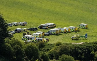 Emergency response vehicles are parked near the scene of a train crash by Stonehaven in northeast Scotland on August 12, 2020. - A passenger train derailed in northeast Scotland on Wednesday, with reports of "serious injuries" in what First Minister Nicola Sturgeon described as "an extremely serious incident". (Photo by Michal Wachucik / AFP) (Photo by MICHAL WACHUCIK/AFP via Getty Images)