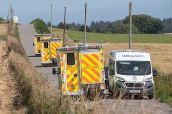 Ambulances are pictured near the scene of a train crash by Stonehaven in northeast Scotland on August 12, 2020. - A passenger train derailed in northeast Scotland on Wednesday, with reports of "serious injuries" in what First Minister Nicola Sturgeon described as "an extremely serious incident". (Photo by Michal Wachucik / AFP) (Photo by MICHAL WACHUCIK/AFP via Getty Images)
