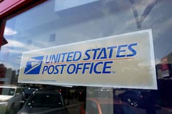 CHICAGO, ILLINOIS - AUGUST 13: A sign is attached to the window of a United State Postal Service facility on August 13, 2020 in Chicago, Illinois.  President Donald Trump said today that he opposes additional funding for the Postal Service because the lack of additional funding would make it more difficult to deliver mail-in ballots. (Photo by Scott Olson/Getty Images)