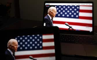 epa08612044 Democratic Presidential nominee Joe Biden, displayed on a computer, speaks during the Democratic National Convention, in New York City, 18 August 2020.  EPA/JASON SZENES