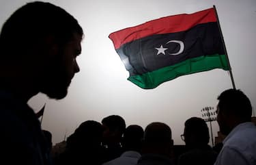 TOPSHOT - Libyans gather during the funeral of fighters loyal to the Government of National Accord (GNA) in the capital Tripoli, on April 24, 2019, after they were reportedly killed during clashes with forces loyal to strongman Khalifa Haftar in al-Hira region, about 70 kilometres south of Tripoli. (Photo by FADEL SENNA / AFP)        (Photo credit should read FADEL SENNA/AFP via Getty Images)