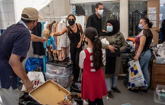 BEIRUT, LEBANON - AUGUST 20: Volunteers help to find clothing and toys for residents at an aid station distributing clothes, toys and household items on August 20, 2020 in Beirut, Lebanon. The explosion at Beirut's port killed over 200 people, injured thousands, and upended countless lives. There has been little visible support from government agencies to help residents clear debris and help the displaced. As residents continue to clean up after the Beirut port explosion, Lebanon has issued a two week lockdown starting August 21 after Coronavirus cases have surged in the aftermath of the explosion.   (Photo by Chris McGrath/Getty Images)