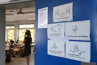 Instructions for hygiene measures to be taken are fixed on a door of a classroom at the Phoenix high school in Dortmund, western Germany, on August 12, 2020, amid the novel coronavirus COVID-19 pandemic. - Schools in the western federal state of North Rhine-Westphalia re-started under strict health guidelines after the summer holidays. (Photo by Ina FASSBENDER / AFP) (Photo by INA FASSBENDER/AFP via Getty Images)