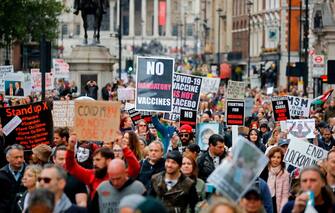 Protesters march down Whitehall in central London to "expose the truth about Covid and lockdown" at a demonstration organised by Save our Rights on August 29, 2020. (Photo by Tolga AKMEN / AFP) (Photo by TOLGA AKMEN/AFP via Getty Images)
