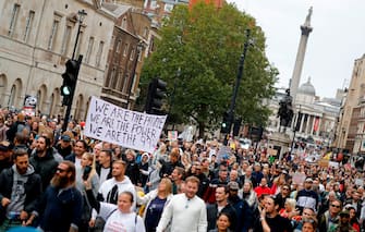 Protesters march down Whitehall in central London to "expose the truth about Covid and lockdown" at a demonstration organised by Save our Rights on August 29, 2020. (Photo by Tolga AKMEN / AFP) (Photo by TOLGA AKMEN/AFP via Getty Images)