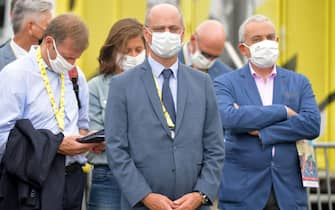 French Minister for Education Jean-Michel Blanquer (C) attends the podium ceremony of "la course by le tour" women's race prior to the 1st stage of the 107th edition of the Tour de France cycling race, 156 km between Nice and Nice, on August 29, 2020. (Photo by Stuart Franklin / POOL / AFP) (Photo by STUART FRANKLIN/POOL/AFP via Getty Images)