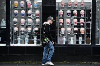 GLASGOW, SCOTLAND - SEPTEMBER 02: Members of the public walk past s shop selling face coverings on September 02, 2020 in Glasgow, Scotland. Starting last night, Scottish authorities banned people in Glasgow city, West Dunbartonshire and East Renfrewshire from visiting other households. The new rules, which last for two weeks, come as 135 new coronavirus cases were reported in the Greater Glasgow and Clyde area in the last two days. (Photo by Jeff J Mitchell/Getty Images)