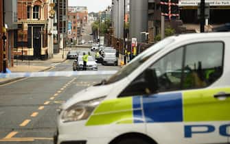 Police guard a cordon on Livery Street following a major stabbing incident in the centre of Birmingham, central England, on September 6, 2020. - British police declared a "major incident" early on September 6 after multiple people were stabbed in the centre of England's second city Birmingham. Violence broke out at about 12:30 am (2330 GMT Saturday) in and around the Arcadian Centre, a popular venue filled with restaurants, nightclubs and bars. (Photo by Oli SCARFF / AFP) (Photo by OLI SCARFF/AFP via Getty Images)
