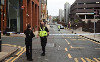 Police guard a cordon on Livery Street following a major stabbing incident in the centre of Birmingham, central England, on September 6, 2020. - British police declared a "major incident" early on September 6 after multiple people were stabbed in the centre of England's second city Birmingham. Violence broke out at about 12:30 am (2330 GMT Saturday) in and around the Arcadian Centre, a popular venue filled with restaurants, nightclubs and bars. (Photo by Oli SCARFF / AFP) (Photo by OLI SCARFF/AFP via Getty Images)