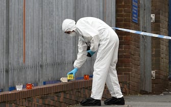 A police forensics officer gathers evidence inside a cordon on Irving Street, following a major stabbing incident in the centre of Birmingham, central England, on September 6, 2020. - British police declared a "major incident" early on September 6 after multiple people were stabbed in the centre of England's second city Birmingham. Violence broke out at about 12:30 am (2330 GMT Saturday) in and around the Arcadian Centre, a popular venue filled with restaurants, nightclubs and bars. (Photo by Oli SCARFF / AFP) (Photo by OLI SCARFF/AFP via Getty Images)