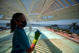 A worker disinfects an area of the Museum of Tomorrow prior to its reopening in Rio de Janeiro, Brazil on September 4, 2020, amid the COVID-19 novel coronavirus pandemic. - India, the United States and Brazil remain the three countries recording the greatest number of new cases over the past seven days, with 77,596, 40,875 and 40,035 cases respectively per day on average, according to an AFP count on Friday at 1100GMT. (Photo by MAURO PIMENTEL / AFP) (Photo by MAURO PIMENTEL/AFP via Getty Images)