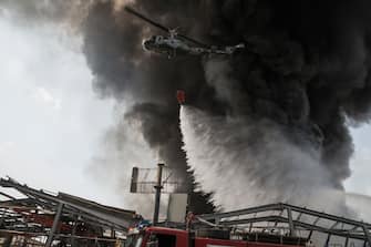 BEIRUT, LEBANON - SEPTEMBER 10: Firefighters respond to a huge blaze at Beirut port on September 10, 2020 in Beirut, Lebanon. The fire broke out in a structure in the city's heavily damaged port facility, the site of last month's explosion that killed more than 190 people. (Photo by Sam Tarling/Getty Images)