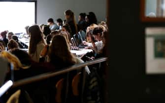 Students work in a lecture theater of the university on October 11, 2017 in Mont-Saint-Aignan, near Rouen, northwestern France. / AFP PHOTO / CHARLY TRIBALLEAU        (Photo credit should read CHARLY TRIBALLEAU/AFP via Getty Images)