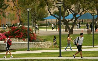 FULLERTON, CA - APRIL 17:  Students walk between classes near the site where the seven people were killed by a gunman on July 12, 1976 inside the California State University, Fullerton library April 17, 2007 in Fullerton, California. Janitor Edward Allaway said later that he went on his killing spree after being taunted by co-workers that gay men were plotting to kill him. Allaway was found innocent by reason of insanity by a judge after the jury was unable to reach a verdict. He remains confined at Patton State Hospital.  (Photo by David McNew/Getty Images)