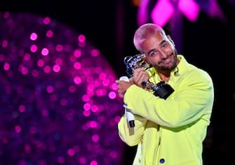 NEW YORK, NEW YORK - AUGUST 30: Maluma accepts the Best Latin award for â  QuÃ© Penaâ   with J Balvin, during the 2020 MTV Video Music Awards at the Skyline Drive-In, broadcast on Sunday, August 30, 2020 in New York City. (Photo by Jeff Kravitz/MTV VMAs 2020/Getty Images for MTV)