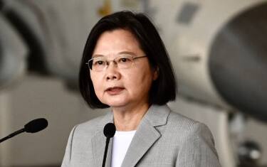 Taiwan's President Tsai Ing-wen (C) speaks in front of a domestically-produced F-CK-1 indigenous defence fighter jet (IDF) during her visit to Penghu Air Force Base on Magong island in the Penghu islands on September 22, 2020. (Photo by Sam Yeh / AFP) (Photo by SAM YEH/AFP via Getty Images)