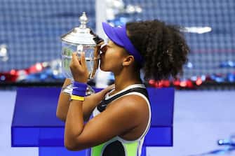 NEW YORK, NEW YORK - SEPTEMBER 12: Naomi Osaka of Japan kisses the trophy in celebration after winning her Women's Singles final match against Victoria Azarenka of Belarus on Day Thirteen of the 2020 US Open at the USTA Billie Jean King National Tennis Center on September 12, 2020 in the Queens borough of New York City. (Photo by Matthew Stockman/Getty Images)